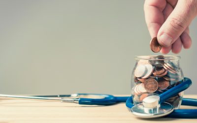 a hand holding a glass of wine