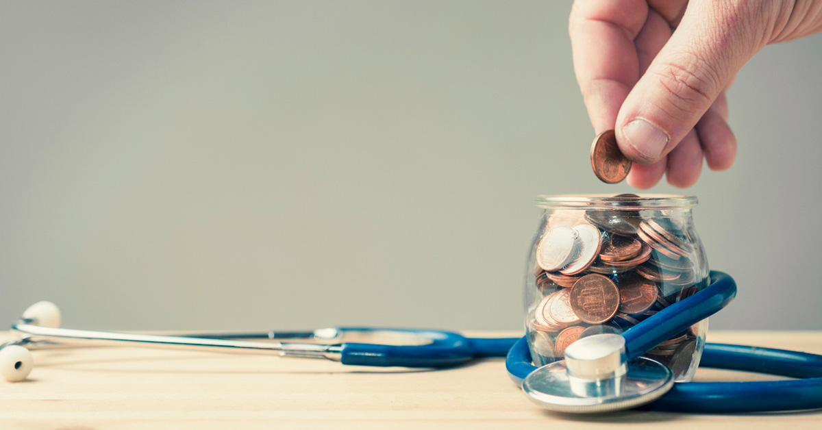 a hand holding a glass of wine
