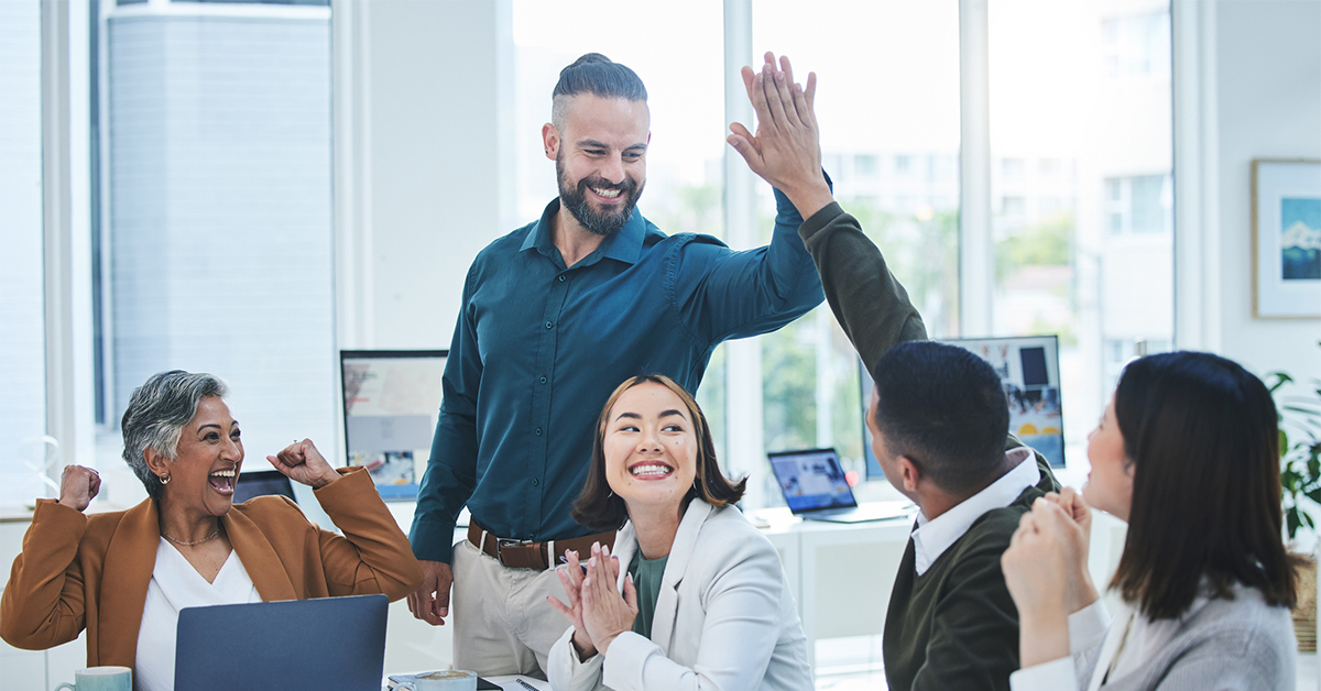 Rachel Tang et al. standing in front of a window