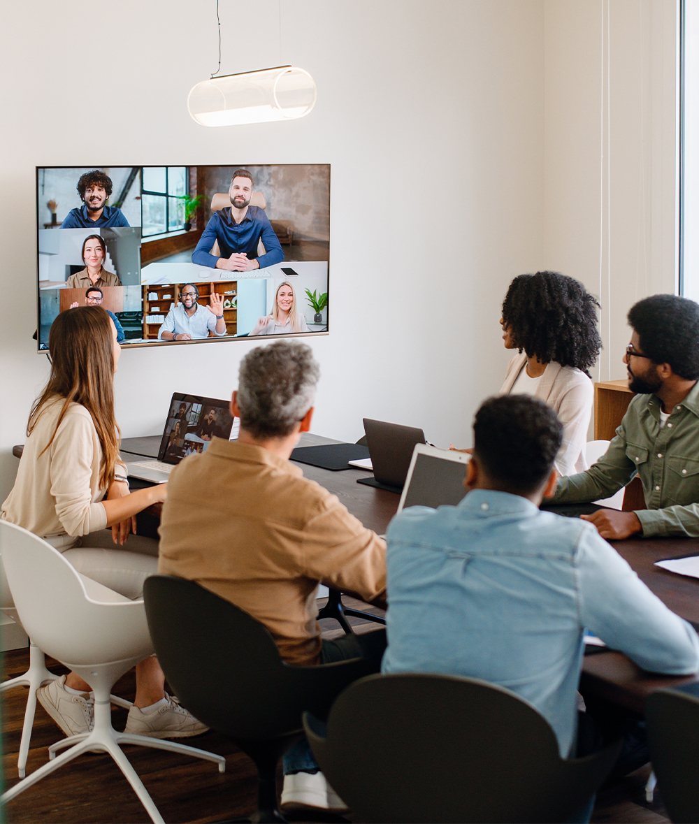 a group of people sitting at a desk