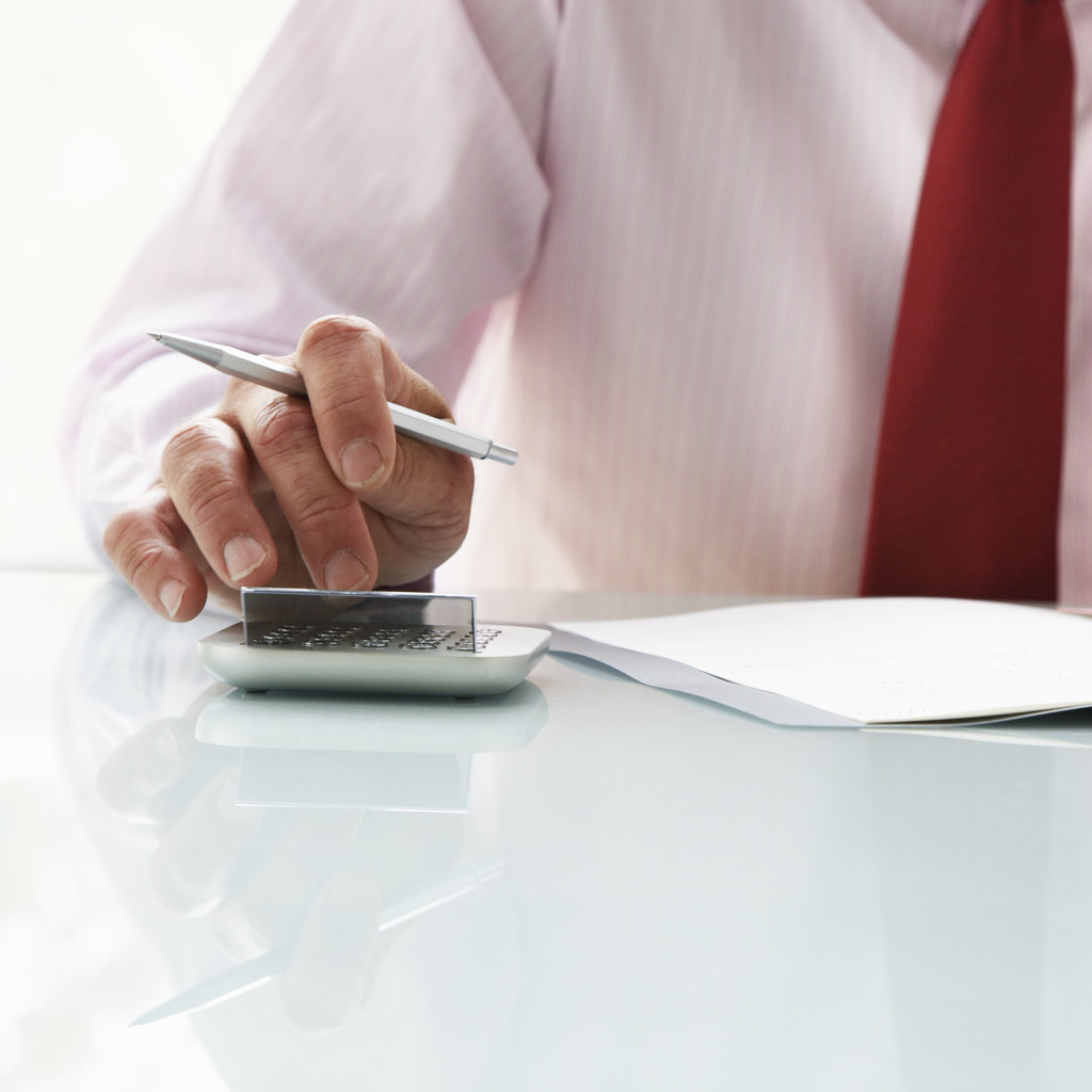 Businessman Using Calculator
